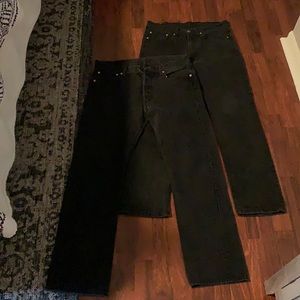 two levi black jeans. in excellent condition